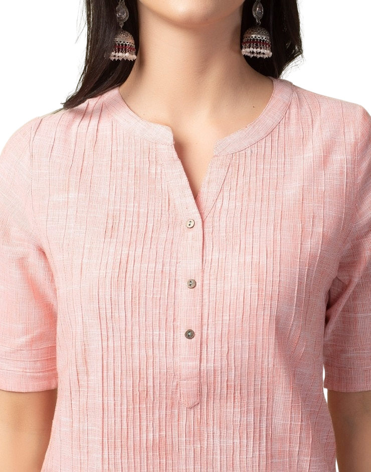 Kurta larga con pliegues. Color rosa