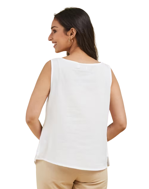 Blusa sin mangas appliqué. Blanca